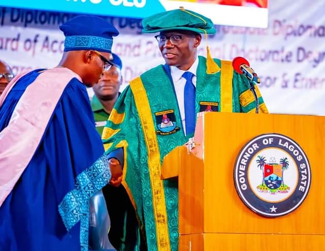 Mubarak Olaniyi Shaking Hands With Lagos State Governor.